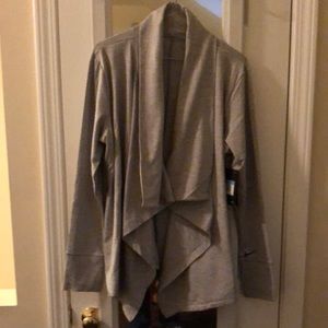 New Nike dry fit polyester spandex over jacket. Very soft and comfortable.